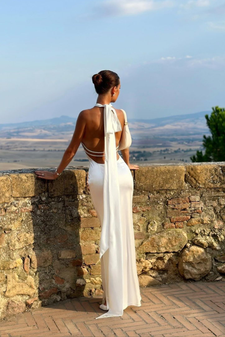 White maxi dress styled front view, figure-defining silhouette