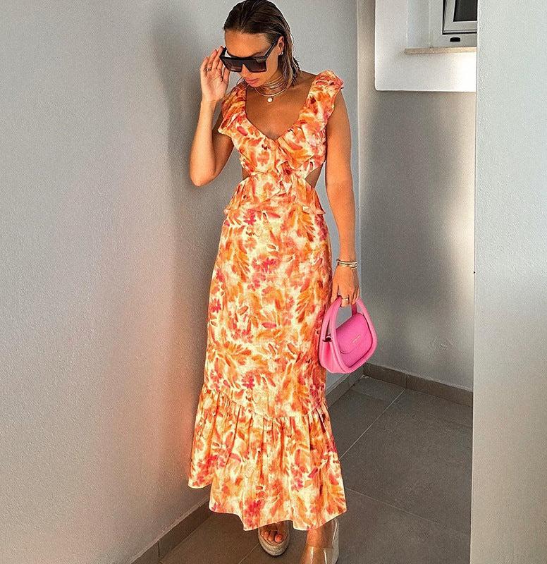 Orange floral maxi dress with V-neckline and cascading ruffle trim