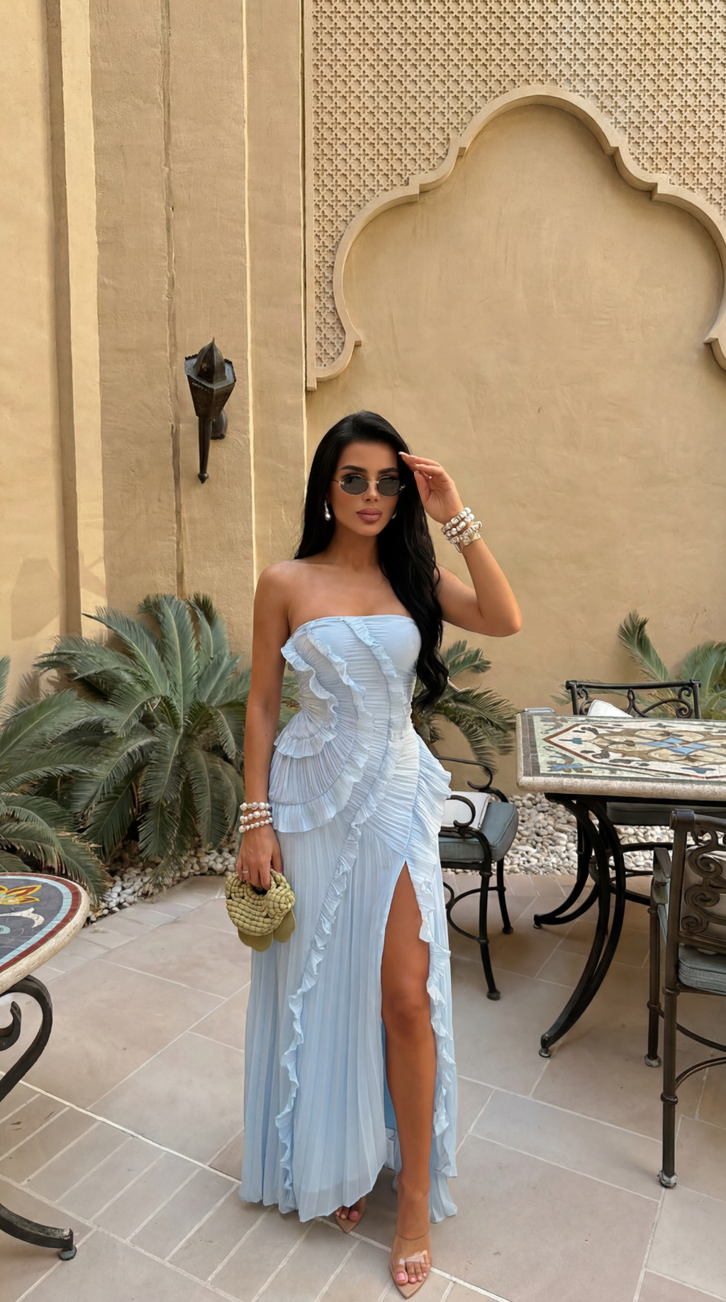 Sky Blue strapless maxi dress shown with its ruffled strapless bodice.