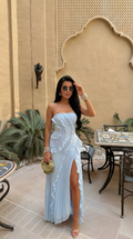Sky Blue strapless maxi dress shown with its ruffled strapless bodice.