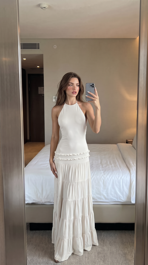 White halter maxi dress with tiered ruffle skirt, mirror view