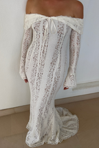 Front view of the White lace maxi dress highlighting the neckline and cut.