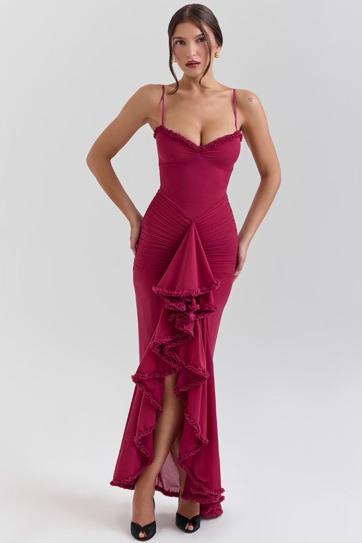 Burgundy bodycon maxi dress shown with its sleek bodycon fit.