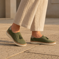 Olive Green slip-on sneakers, front view showing fit and silhouette on foot.