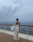 White asymmetrical maxi dress with a strapless neckline