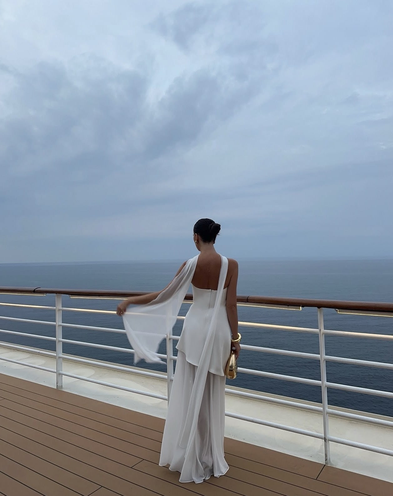 White asymmetrical maxi dress with a strapless neckline