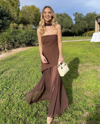 Brown asymmetrical maxi dress styled for a formal evening