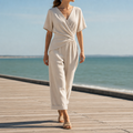 Ivory wrap jumpsuit worn, showing the fit and overall silhouette.