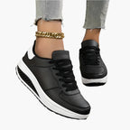 Women's orthopedic sneakers in black with supportive air cushion footbed