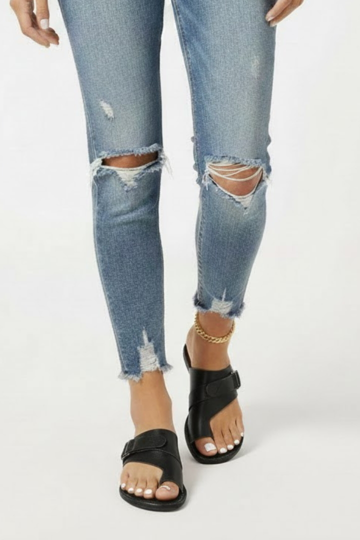 Black comfort sandals with an adjustable buckle and textured upper