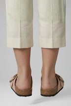 Back view of cream buckle comfort sandals showing textured sole