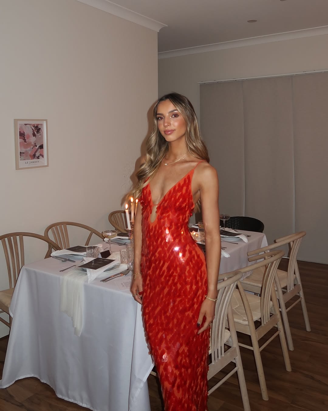 Sequin maxi dress in Red, showing a flared hemline for movement.