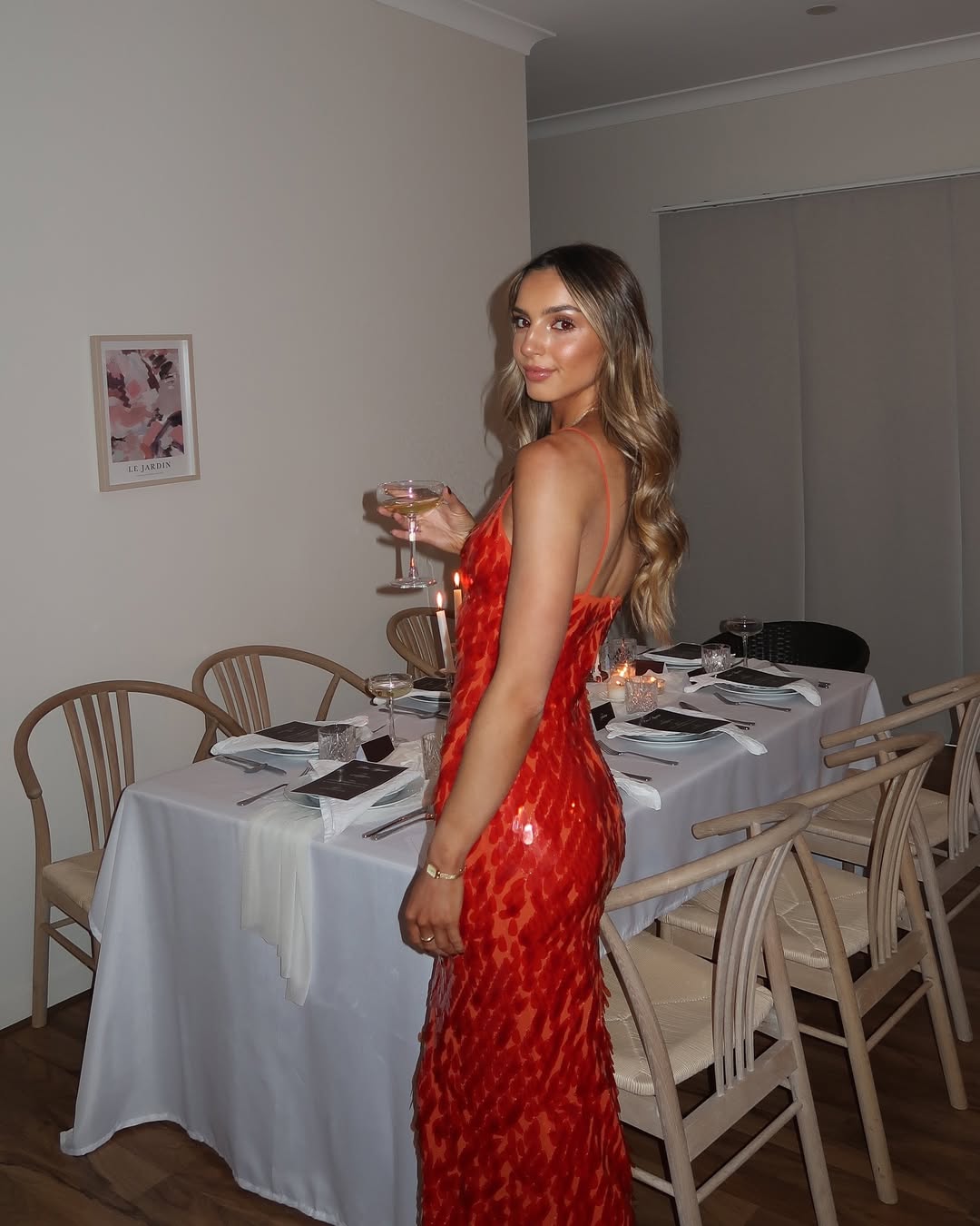 Sequin maxi dress in Red, showing styling for an evening occasion.